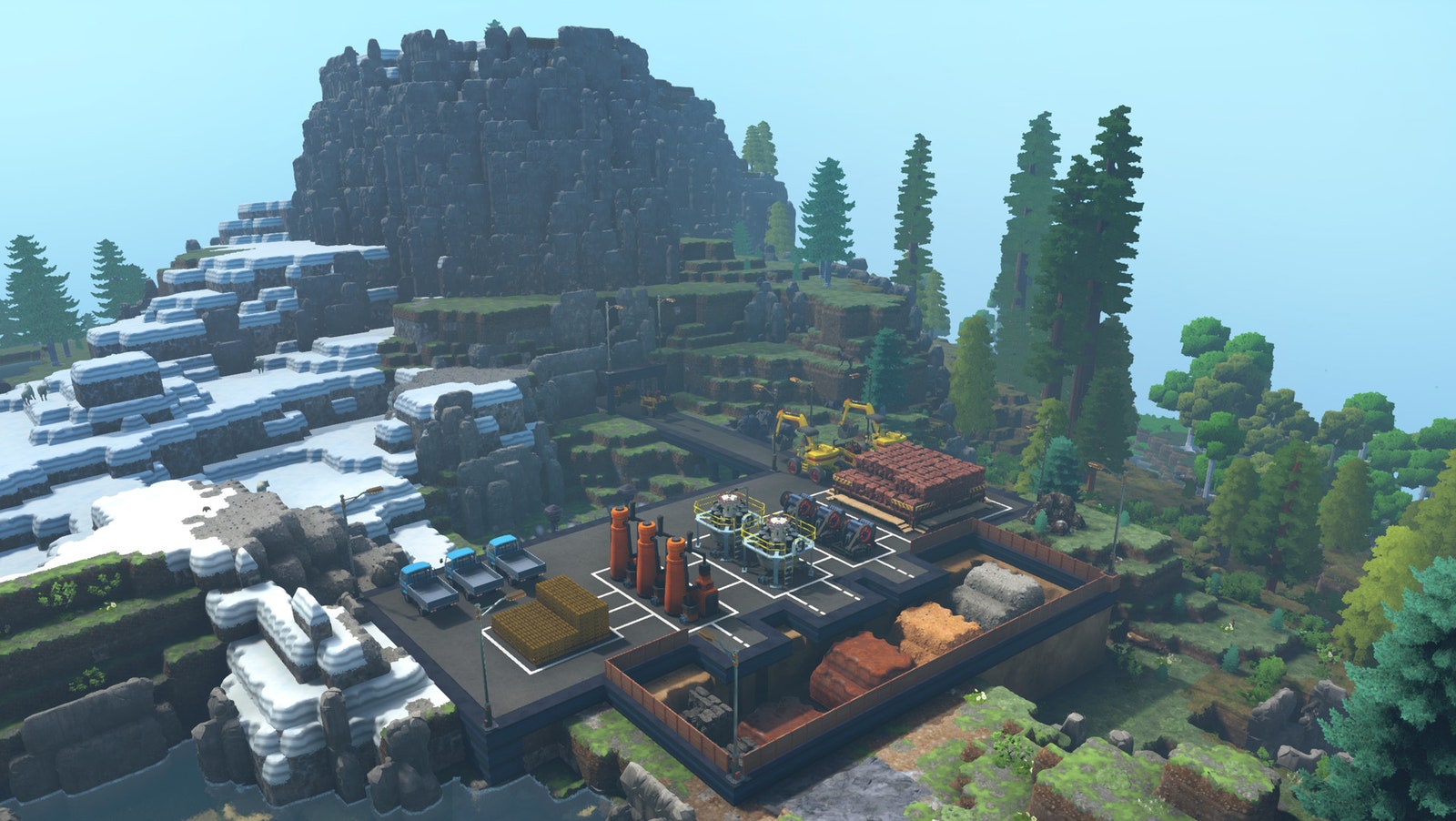 Captura de pantalla del juego Eco, con una gran fábrica en un entorno montañoso